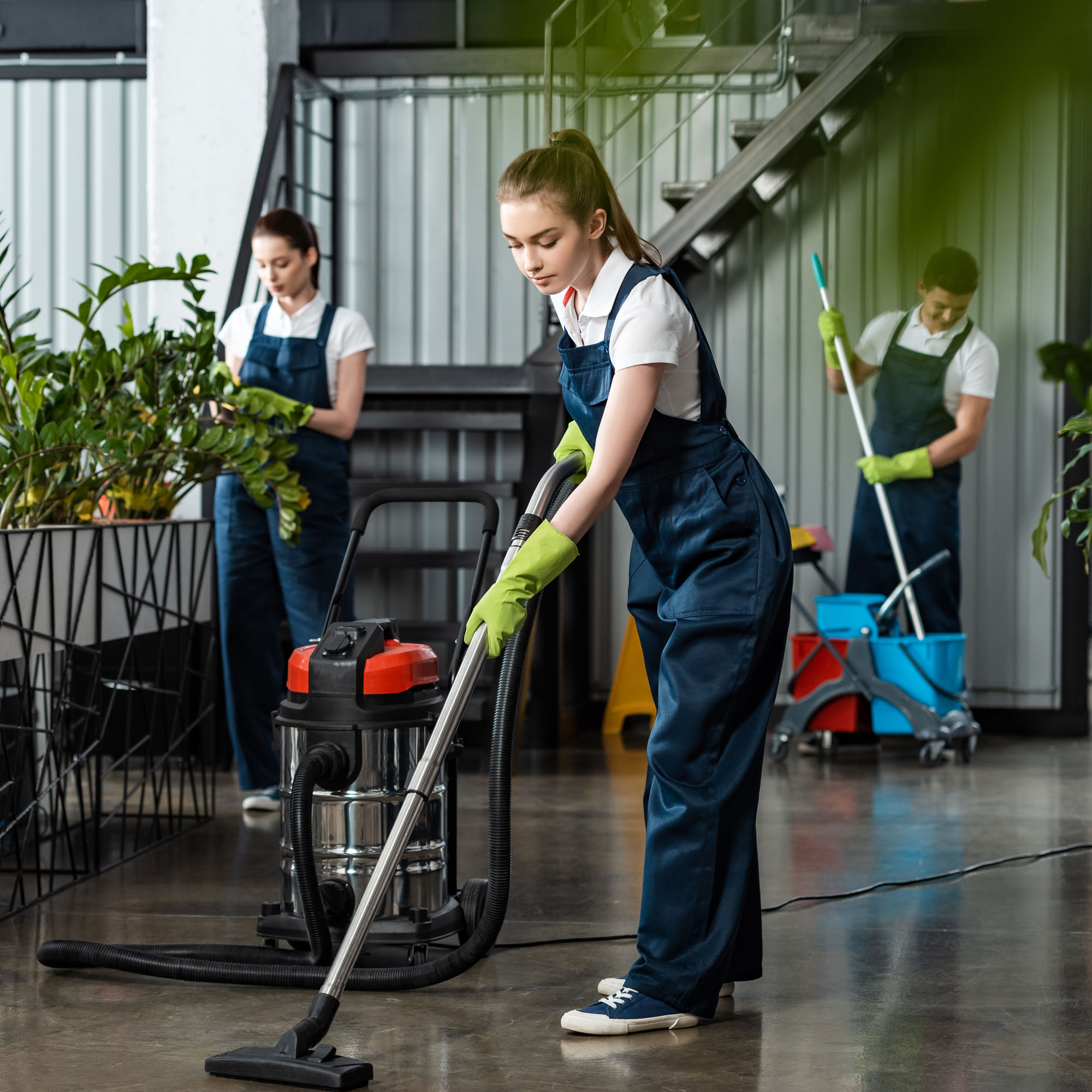 A team of cleaners cleaning an office building