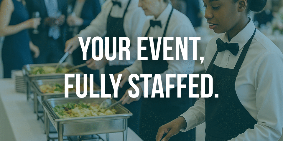 atering staff serving guests at a formal event, representing Transnational Staffing’s event staffing services.