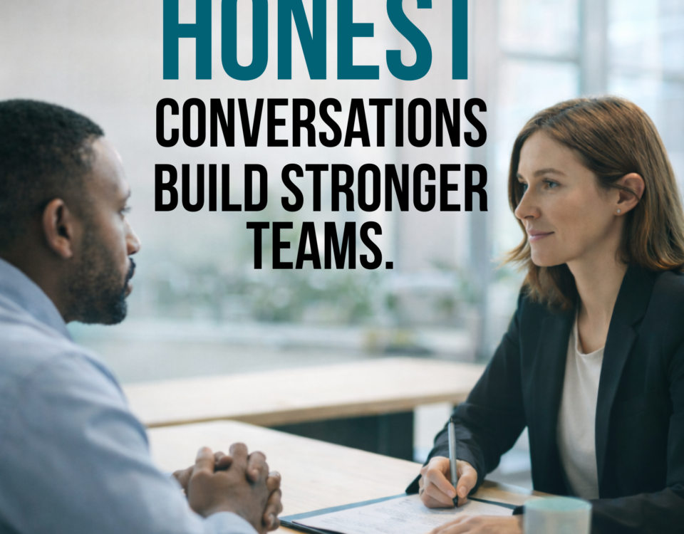 Hiring manager and candidate sitting across from each other during an honest job interview conversation, with text overlay reading “Honest Conversations Build Stronger Teams.